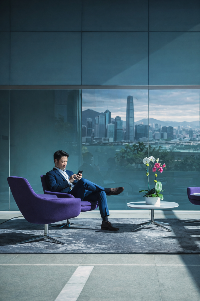Man in modern lobby with skyline-ai generated